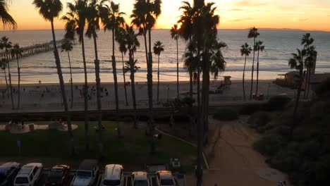 POV-Drone-Aerial-Flight-through-Palm-Trees-at-Sunset-in-California