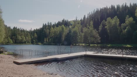 Zoom-In-of-Jetty-at-Kypesjön-Lake-in-Late-Summer,-Borås-Sweden---Wide-Shot
