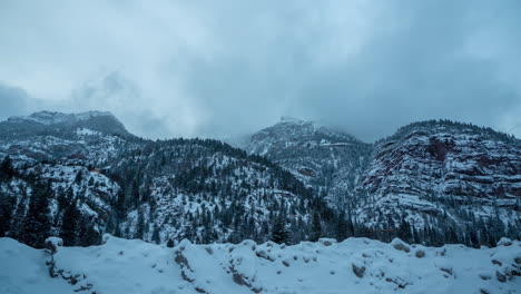 Time-Lapse-of-Dark-Winter-Day-in-Mountains,-Snow-Capped-Hills-and-Valley-Outside-Ouray,-Colorado-USA