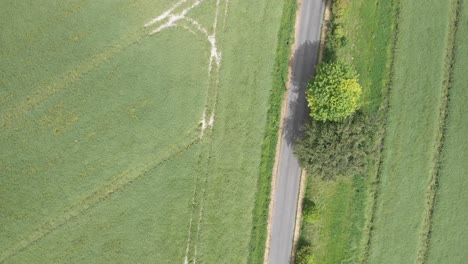 An-aerial-view-of-a-country-road-in-Wiltshire,-England