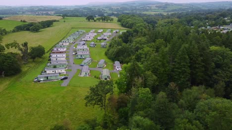 Aerial-pan-of-caravan-park-in-UK-countryside-on-cloudy-day