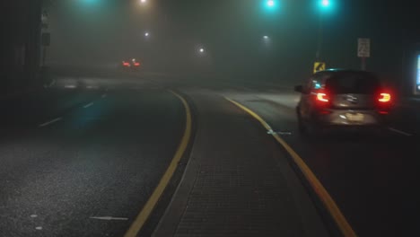 Cars-On-A-Road-On-A-Foggy-Night---wide,-static