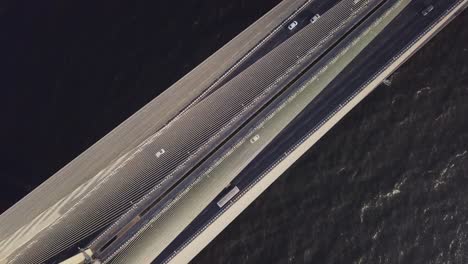 Cinematic-sunset-Aerial-Drone-view-of-Vehicles-Passing-over-Bandra-Worli-Sea-Link-Bridge-in-Mumbai,-India