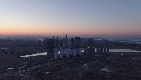 The-dawn-of-a-city-under-construction,-Sogdo,-Korea