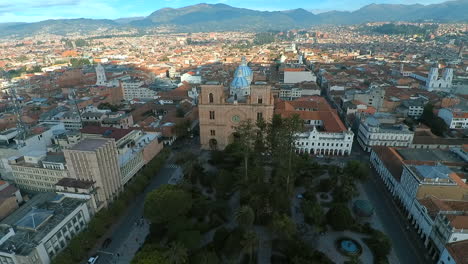Aerial-shots-showing-off-the-beautiful-catholic-churches-and-unique-colonial-architecture-of-Cuenca,-Ecuador