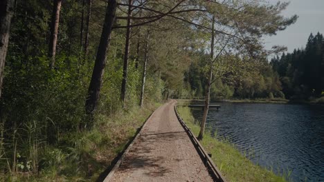 POV-Walking-on-Wooden-Path-By-Kypesjön-Lake-in-Borås-Sweden---Wide-Shot-Tracking-Forward
