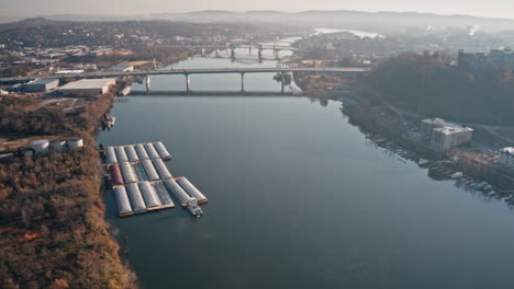Aerial-timelapse-of-barge-and-river-in-Chattanooga,-TN