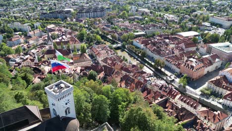 Slovenian-flag-flying-on-Ljubljana-castle-tower-drone-aerial-view