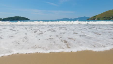 Ocean-waves-crashing-on-the-beach-sand