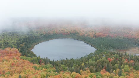 Aerial-flying-over-Lake-Oberg-in-Minnesota-on-a-cloudy-overcast-day-during-autumn