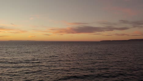 Panorama-of-California-Coastline-and-Beautiful-Pacific-Ocean-Sunset-on-the-Horizon---Aerial