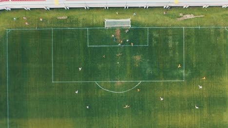 Eastern-europe-football-game-with-players-dron-video-from-above