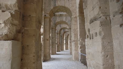 Walking-Through-Passage-Of-Ancient-Amphitheater-In-El-Jem,-Tunisia