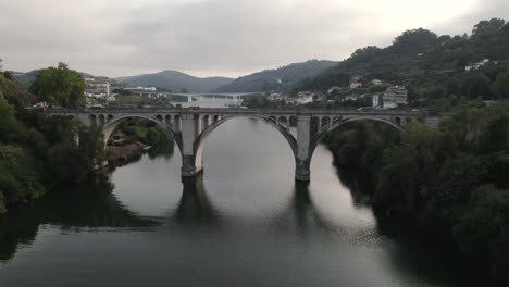 Pull-back-of-bridge-over-tamega-river,-Penafiel-Portugal,-close-up-of-european-landmark