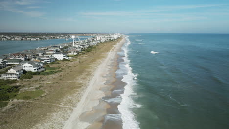 Symmetric-aerial-view-flying-over-Wrightsville-Beach,-North-Carolina-shoreline