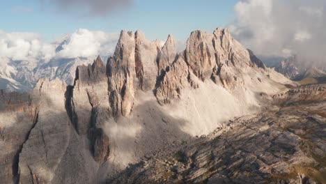 Aerial-view-of-majestic-Croda-Da-Lago-Mountain-with-sun-and-clouds,-Veneto,-Italy