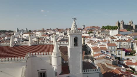 Aerial-view-Saint-Francis-or-Sao-Francisco-church-with-Portuguese-cathedral-in-background-at-Evora,-Portugal
