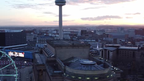 Liverpool-city-Christmas-market-sunset-skyline-and-radio-city-landmark-aerial-view-tilt-down-to-Ferris-wheel