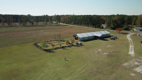 Wedding-venue-set-up-on-farmland-in-Burgaw,-North-Carolina-Aerial-flyover