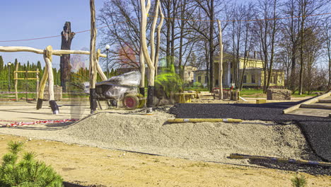 Laying-the-rubber-turf-mulch-at-a-newly-built-playground-in-a-public-park-for-child-safety---time-lapse