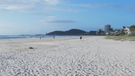 Few-People-Walking-At-Palm-Beach-During-Coronavirus-Pandemic---Gold-Coast,-Queensland,-Australia