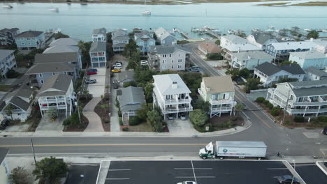 Residential-housing-along-shorefront-Wrightsville-Beach,-North-Carolina-orbit-aerial