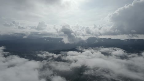 Aerial-flying-forward-among-clouds.-Dramatic-landscape