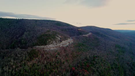 Aerial-drone-footage-of-a-beautiful-scenic-highway-in-the-Appalachian-mountains-during-fall-autumn-at-sunset-with-beautiful-light