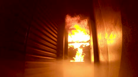 Slow-motion,-POV,-of-flashover-during-firefighter-training-inside-a-burning-simulator