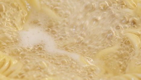 Bubbles-And-Steam-From-Hot-Boiling-Noodles-For-Ramen---macro-slow-motion