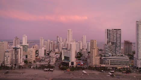 An-aerial-shot-of-the-sun-setting-on-the-skyline-of-Cartagena,-Colombia