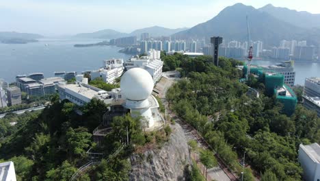 Chinese-University-of-Hong-Kong-radar-dome-overlooking-Hong-Kong-bay,-Aerial-view