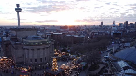 Liverpool-city-sunset-skyline-Christmas-market-and-radio-city-landmark-aerial-view-pan-right