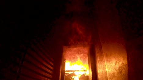 Flames-erupt-inside-a-fire-training-simulator-and-flashover-along-the-ceiling