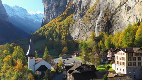 Revealing-drone-shot-of-the-Staubbach-waterfall-church-in-Lauterbrunnen-Bernese-Oberland-Switzerland