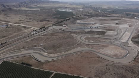 Almeria-race-track-from-a-high-angle,-full-view-of-the-dusty-desert-surrounding