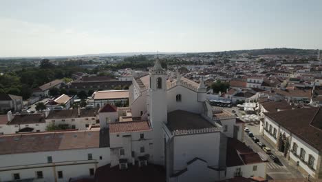 Aerial-pullback-São-Francisco-Church-and-Monastery-know-as-Chapel-of-bones,-Evora