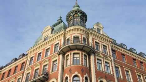 Low-angle-view-of-a-historic-building-on-Strandvägen-street-showcasing-beautiful-European-architecture-in-Stockholm,-Sweden-on-a-bright-sunny-day
