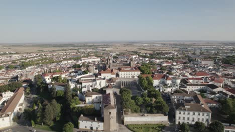 Aerial-view-of-Evora-downtown-travel-destination-in-Portugal,-orbital-cityscape-of-Portuguese-traditional-city