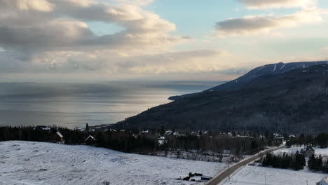 Beautiful-Coastal-Winter-Scenery-Of-Charlevoix---aerial-panning-shot