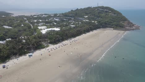 Tourists-Enjoying-At-The-Four-Mile-Beach-Near-The-Headland-In-Port-Douglas,-Far-North-Queensland,-Australia