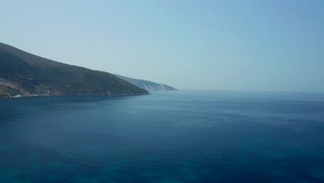 Flyover-mediterranean-sea-towards-beautiful-mountains-shore-Landscape,-Kefalonia-Island