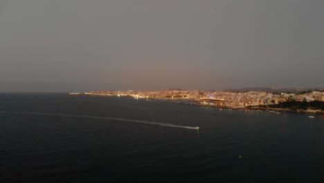 Aerial-drone-video-from-Malta,-St-Pauls'-Bay-and-Bugibba-area-at-sunset