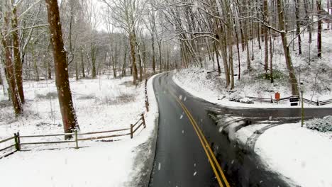Truck-driver-point-of-view-on-curvy-road-during-winter-snow-storm