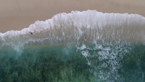 drone-aerial-waves-crashing-footage-white-sand-beach-and-blue-water