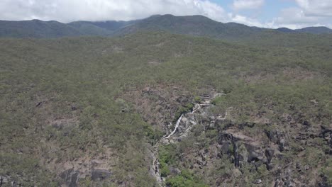 Beautiful-Davies-Creek-Falls-In-The-Rain-Forest-In-Queensland,-Australia---aerial-drone-shot