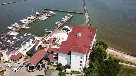 Cinematic-Aerial-of-Chesapeake-Bay-Coastal-Buildings,-Railway-Museum,-Harbor-With-Boat-Marina