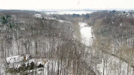 Huge-mansion-estate-in-forest-woods-during-winter-snow-storm