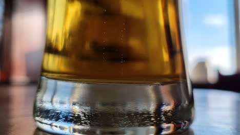 Small-bubbles-rise-and-float-up-slowly-from-the-bottom-of-a-glass-of-beer