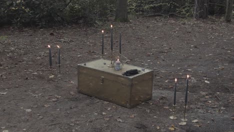 Locked-chest-with-candelabras-in-the-wood